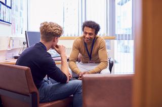 student getting help from a professional 