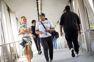 Coppin students walking to class across bridge