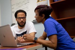 A student receives computer assistance in the IT Student Service Center (ITSSC)